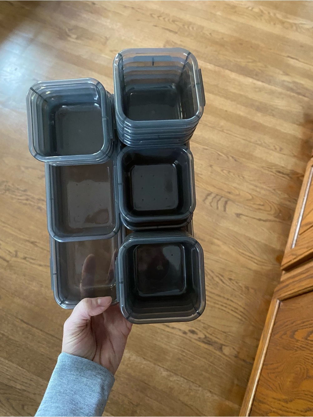 Stack of Small Black Plastic Containers